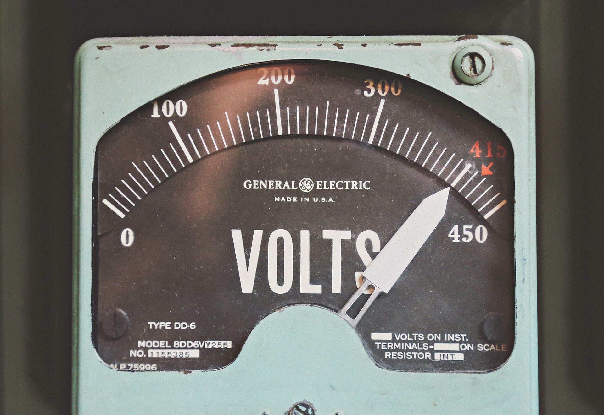 A photo of a vintage volt meter.